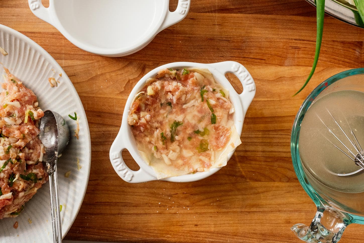 Adding soup to Tiktok soup dumpling lasagna | www.iamafoodblog.com