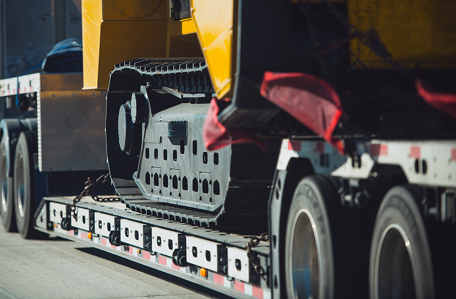 World's Largest Rotator Tow Truck Utilized After Excavator Falls in Parking Garage