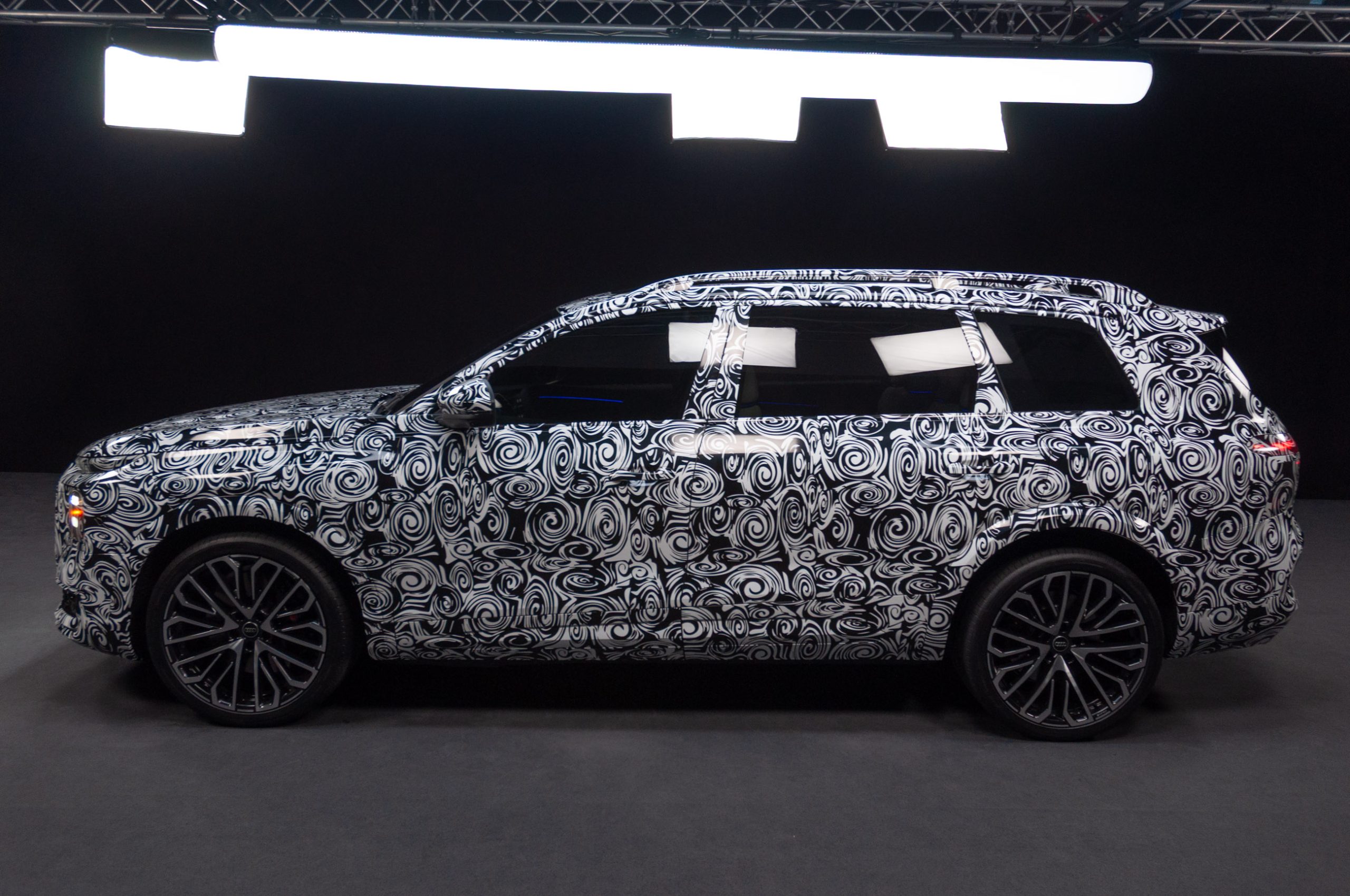 2027 Audi Q9 Premium Highlights Generous Cupholder Design and Sophisticated Audio System with Seat Vibration Innovation