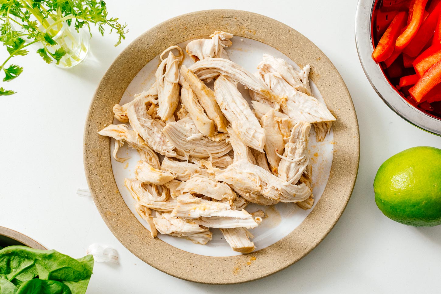 Shredding chicken for Thai red curry ramen | www.iamafoodblog.com