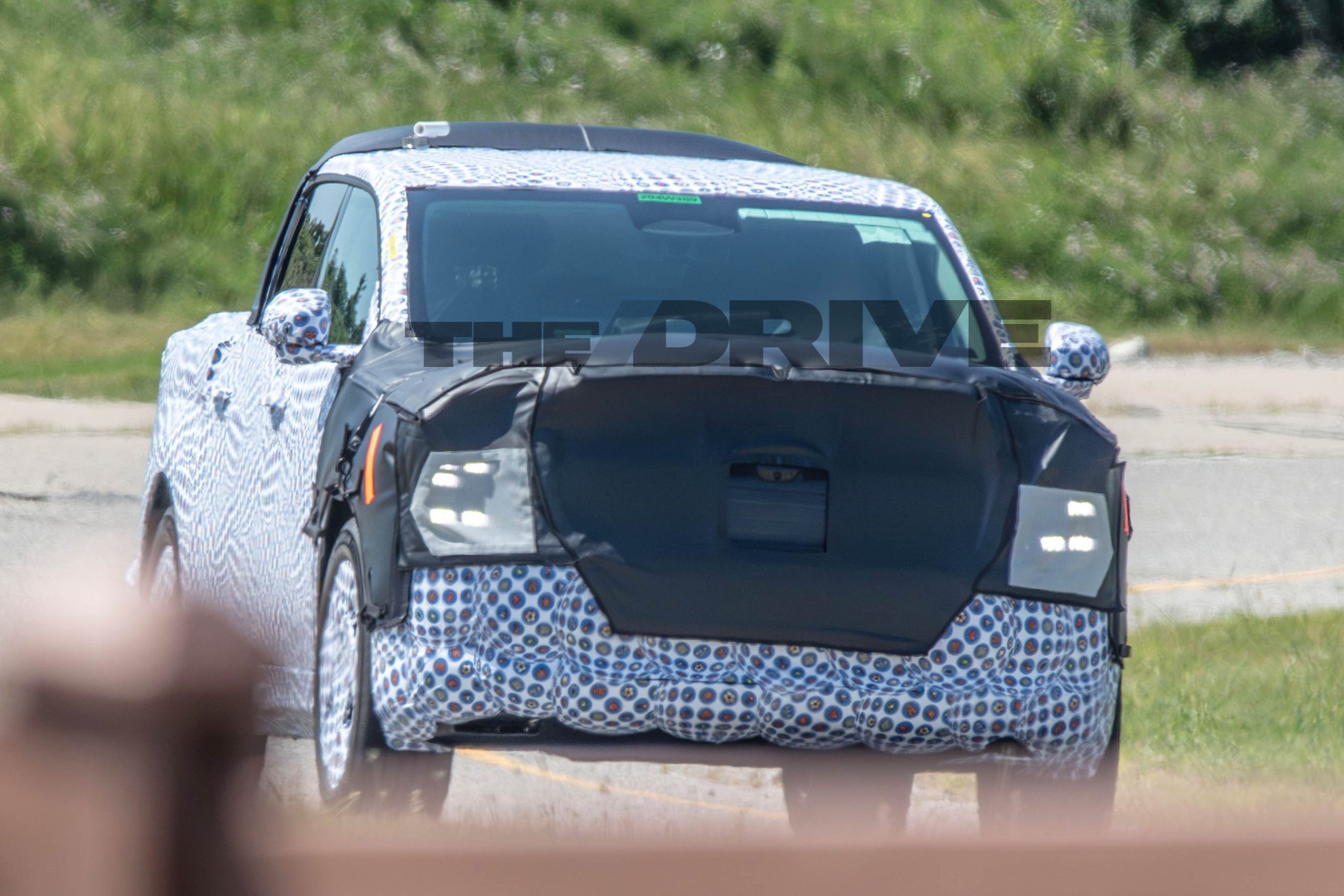 Ford's $30,000 Electric Pickup Seen Beside an Expedition