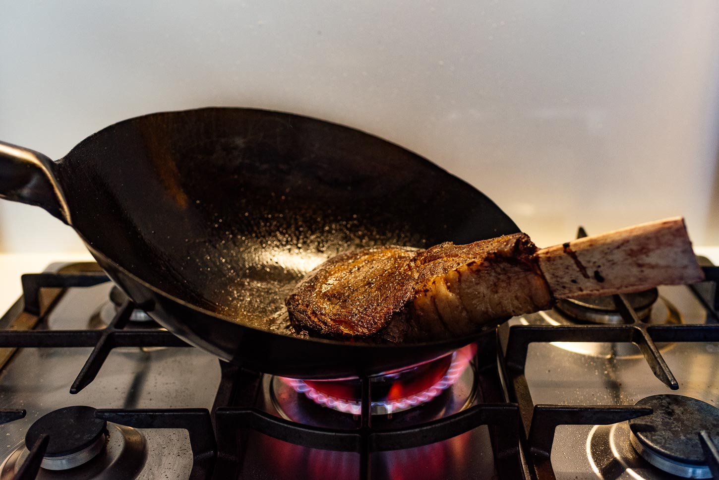 searing a tomahawk steak with a wok | www.iamafoodblog.com