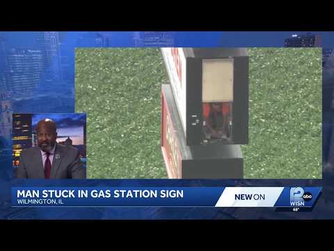 Incident Involving a Man Stuck Inside a Truck Stop Sign Featuring a Lift Mechanism